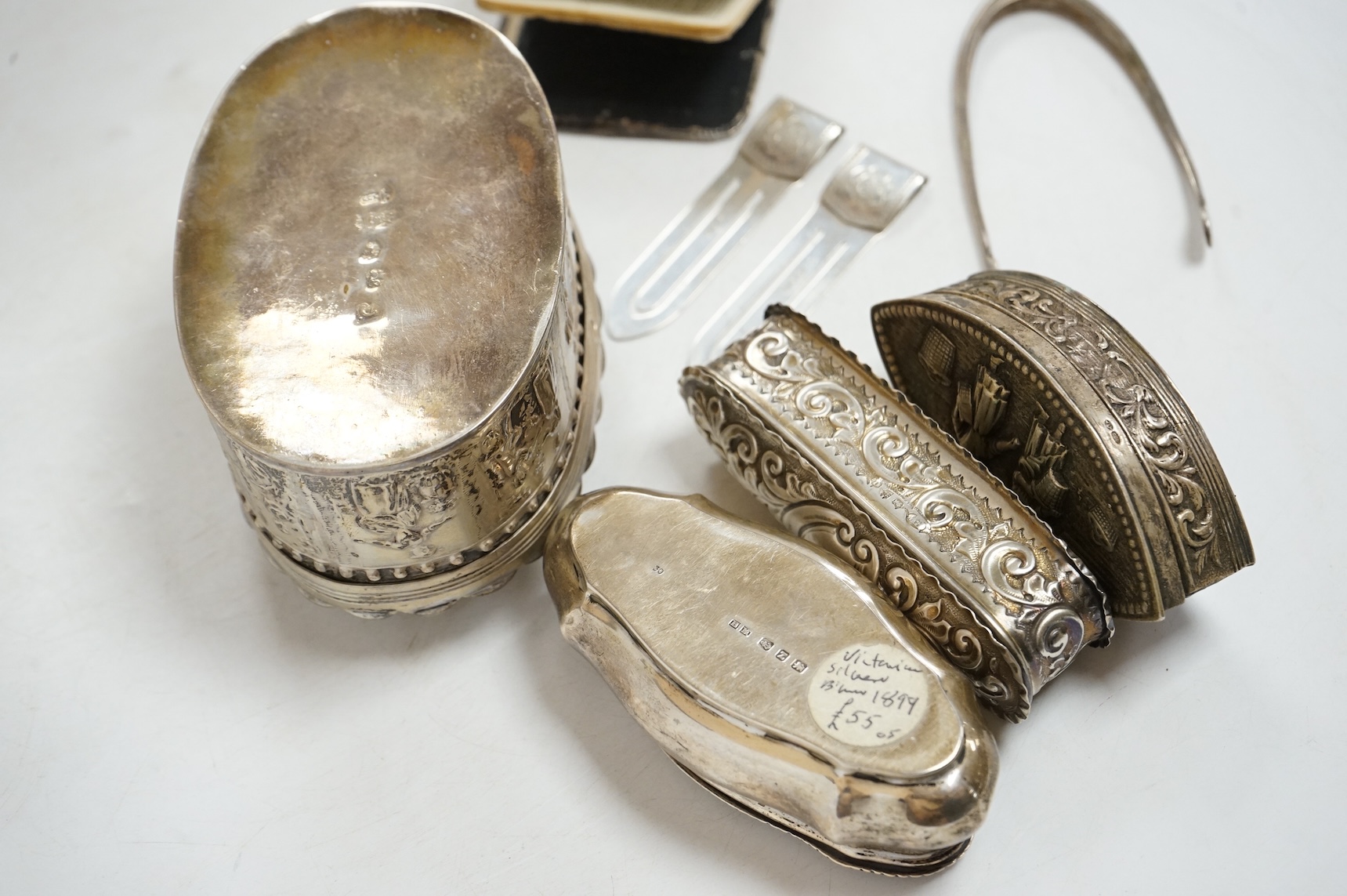 Three late 19th/early 20th century repousse silver trinket boxes, including one with Reynold's Angels decoration, Birmingham, 1899, 91mm, a larger 19th century Dutch white metal oval box and cover, a pair of wishbone sil